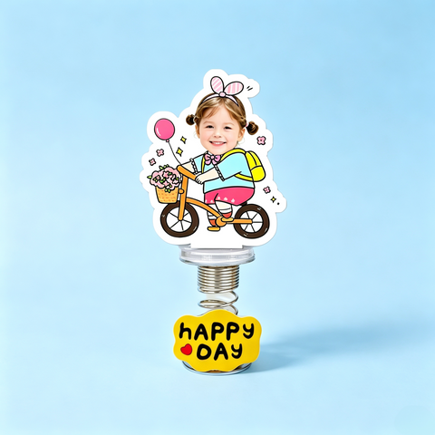 Birthday Bike Custom Photo Spring Bobblehead — personalized acrylic spring figure made from your photo, girl on a bicycle