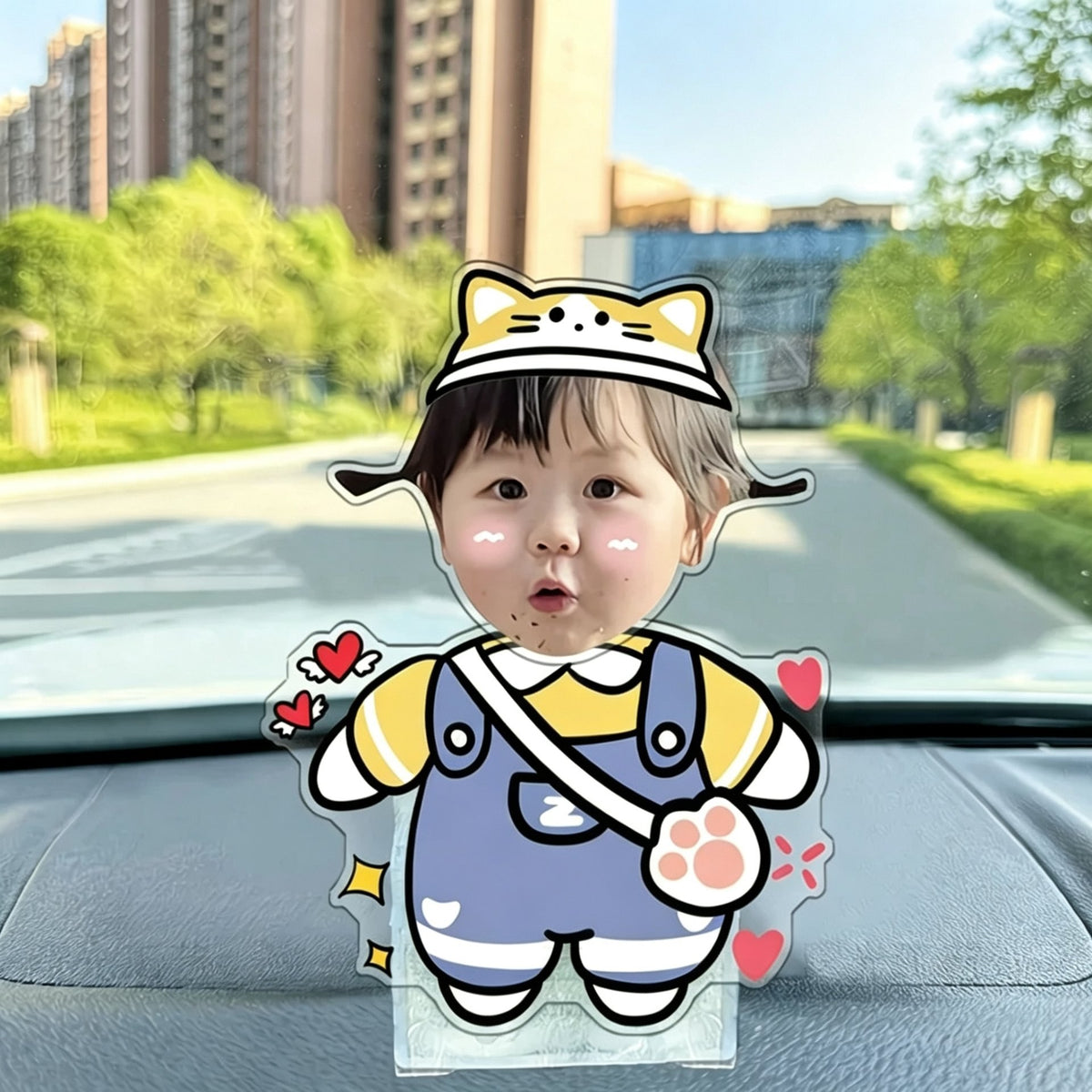 Custom cat ear baby photo wobble figure — adorable toddler in a cat-ear hat and blue overalls with floating hearts and a paw patch, personalized wobbling desk ornament