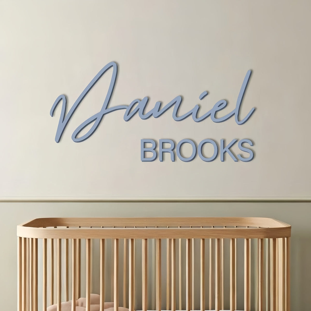 Personalized blue acrylic name sign as nursery wall art for a baby boy
