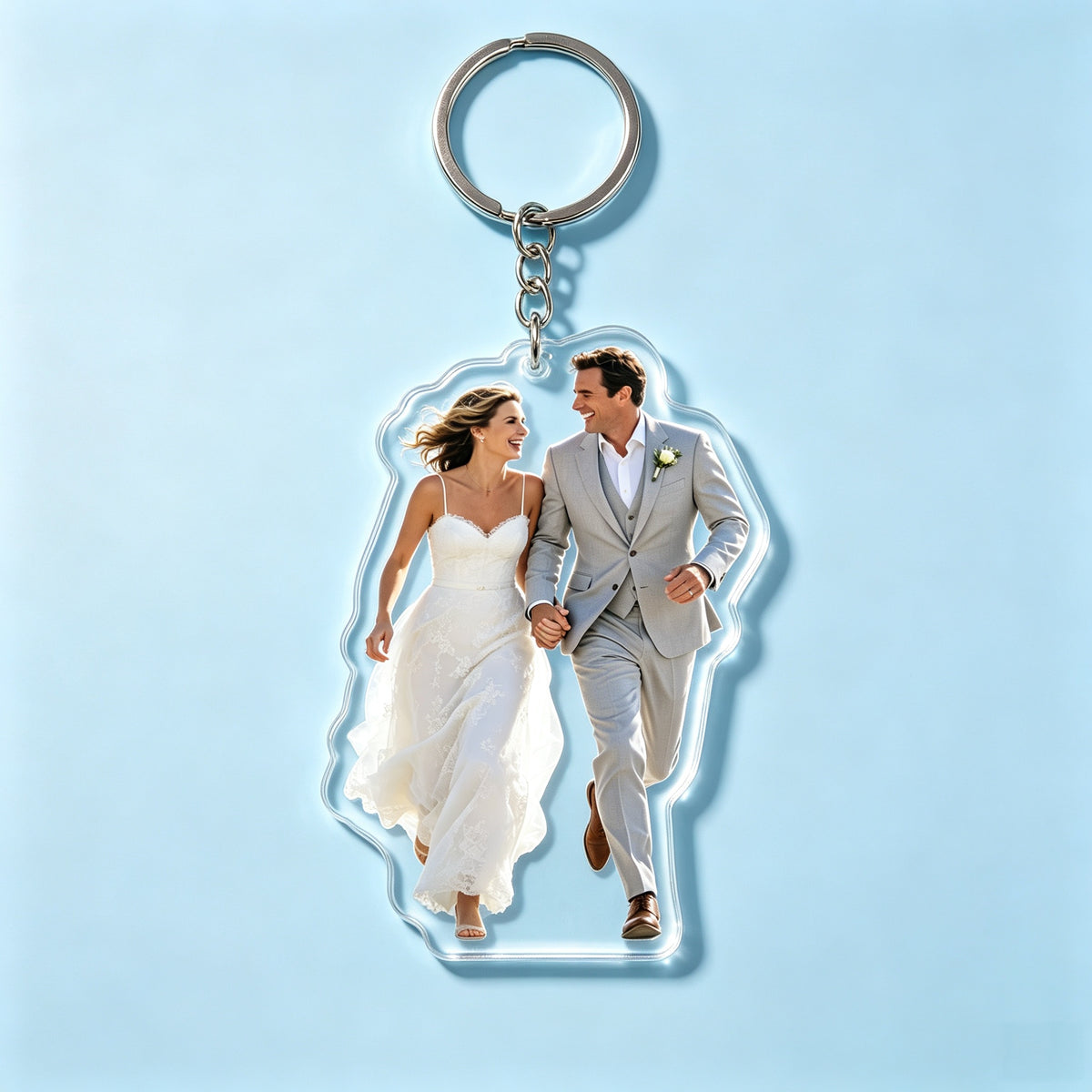 Custom acrylic photo keychain featuring a happy couple running hand in hand on their wedding day