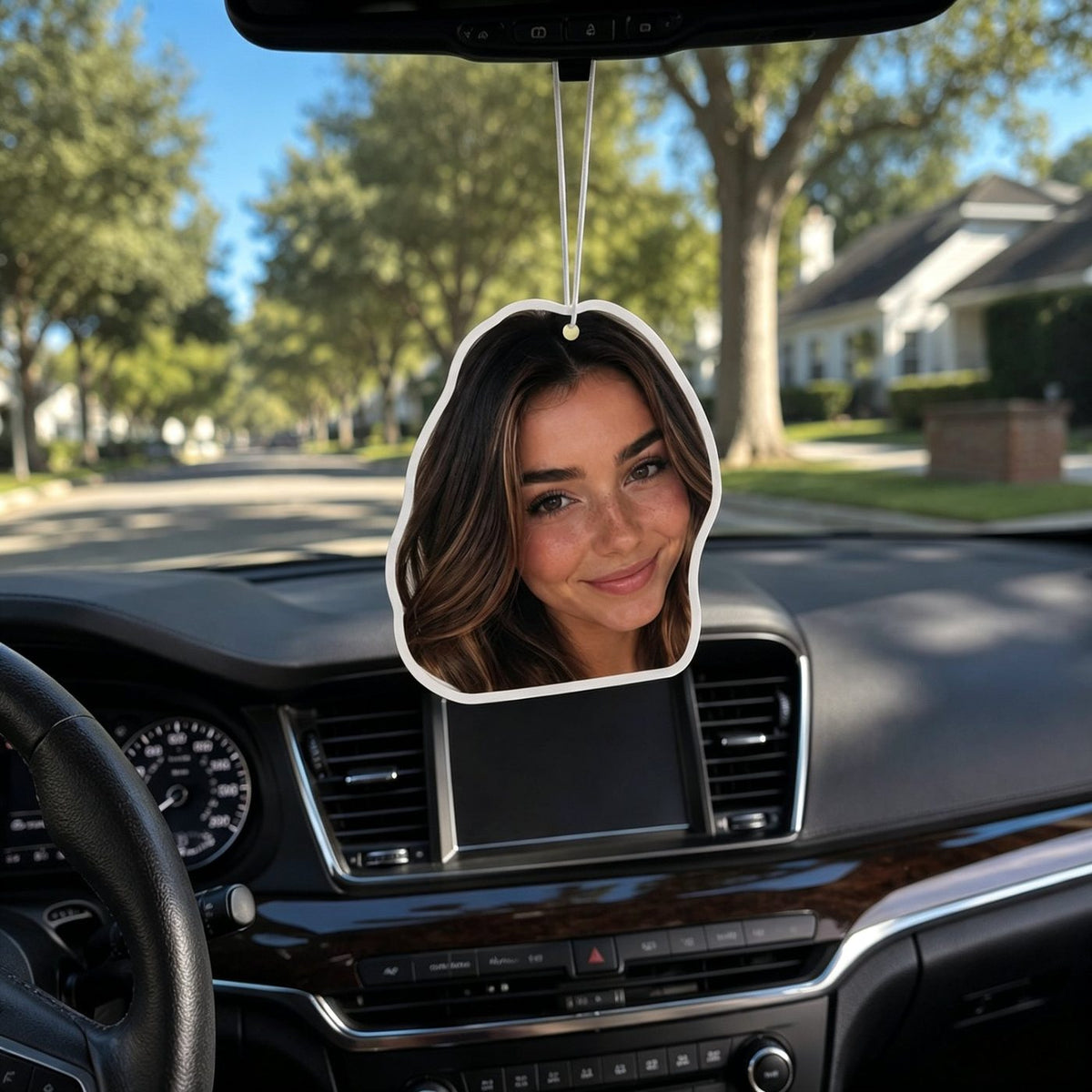 Custom photo air freshener hanging on a car rearview mirror — personalized car interior decor featuring a smiling woman
