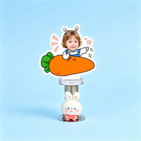 Carrot Baby Custom Photo Spring Bobblehead — personalized acrylic spring figure made from your photo, baby holding a big