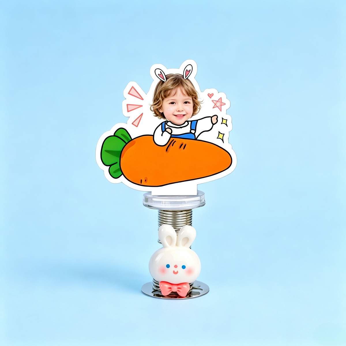 Carrot Baby Custom Photo Spring Bobblehead — personalized acrylic spring figure made from your photo, baby holding a big