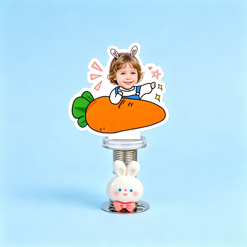Carrot Baby Custom Photo Spring Bobblehead — personalized acrylic spring figure made from your photo, baby holding a big
