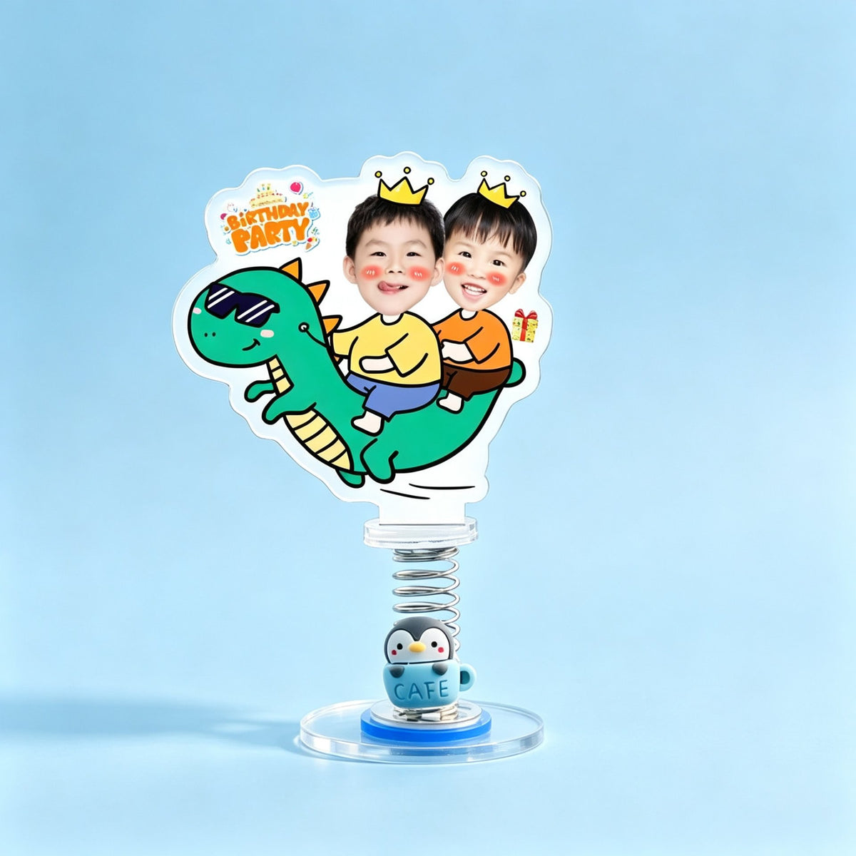 Custom dinosaur party duo photo spring bobblehead — two boys with golden crowns riding a cool green dinosaur with a Birthday Party sign, acrylic figure bouncing on a spring base