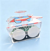 Close-up of the custom wobble figure acrylic base with superhero print and two adhesive pads for secure display