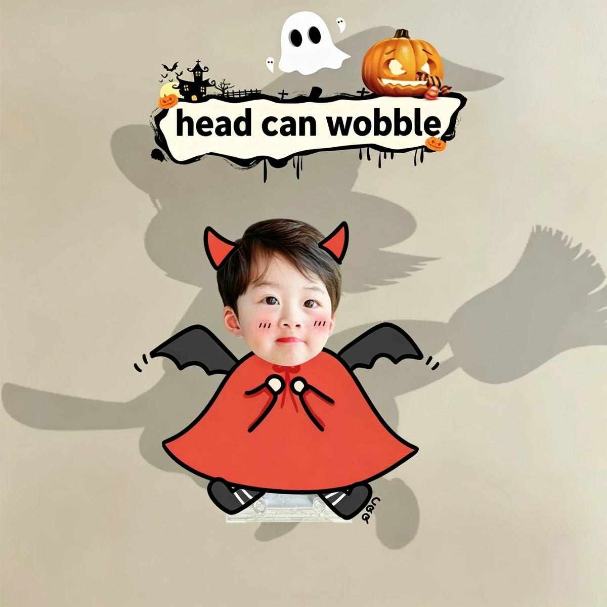 Custom little devil pumpkin photo wobble figure — little boy in a red devil costume with bat wings, personalized Halloween wobbling desk ornament