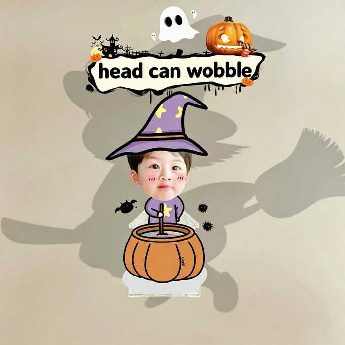 Custom little wizard cauldron photo wobble figure — little boy in a purple star witch hat stirring a pumpkin cauldron with bats around, personalized Halloween wobbling desk ornament