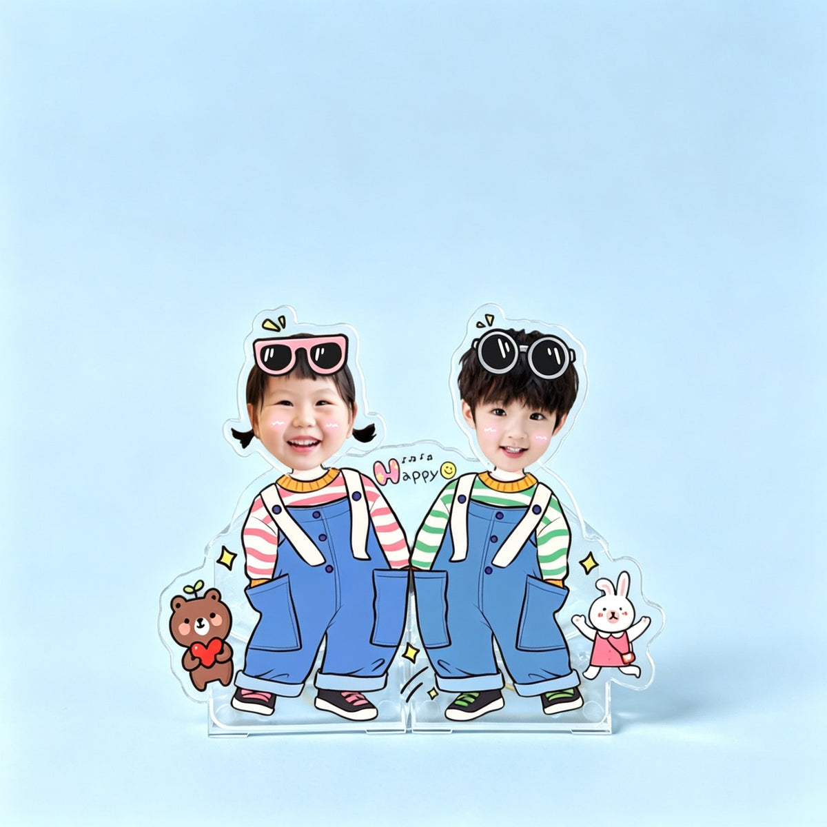 Overalls for two custom photo wobble figure — two kids in denim overalls with playful sunglasses and cute bear and bunny charms on a soft blue background, personalized acrylic display that wobbles