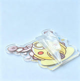 Protective film peeling off a custom wobble figure acrylic figure, revealing the glossy scratch-free printed surface
