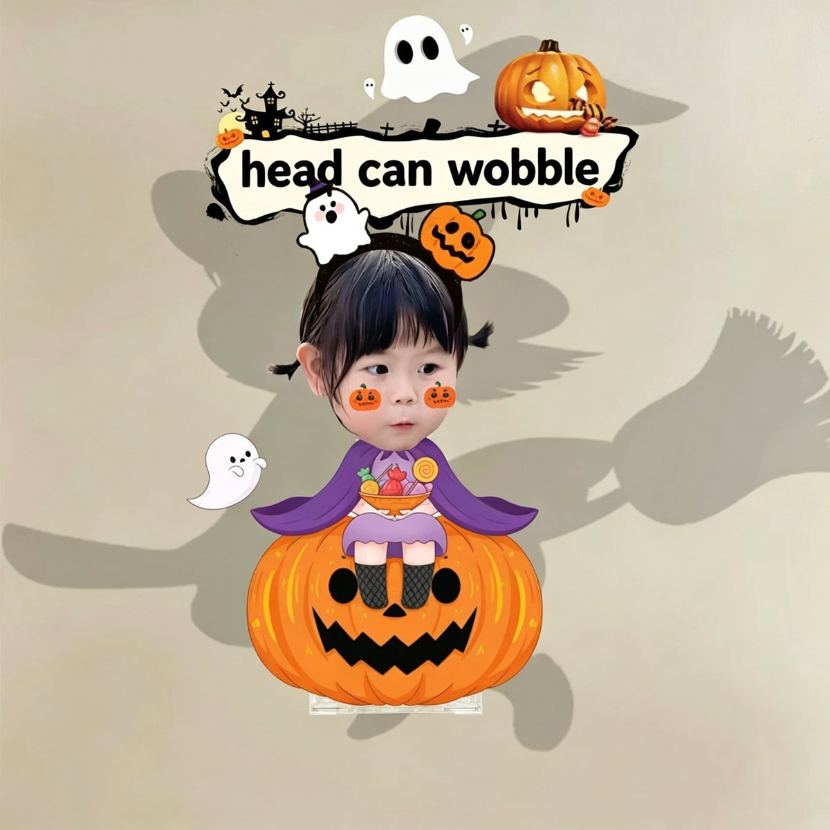 Custom purple witch pumpkin photo wobble figure — little girl in a purple witch cape sitting on a carved jack-o'-lantern with little ghosts, personalized Halloween desk ornament
