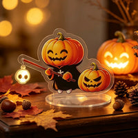 Halloween pumpkin acrylic standee sensor light — smiling jack-o'-lantern character holding a glowing skull staff, motion-activated LED light on an acrylic stand