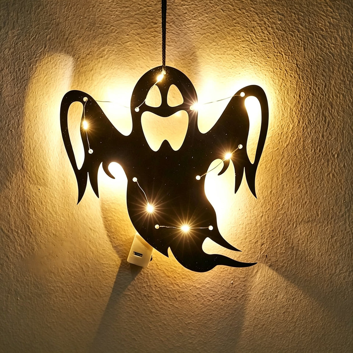 Halloween ghost acrylic wall art light — friendly ghost silhouette with flowing arms glowing with warm LED fairy lights